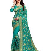 Green embroidered satin saree with blouse