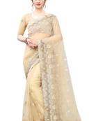 Beige embroidered net saree with blouse