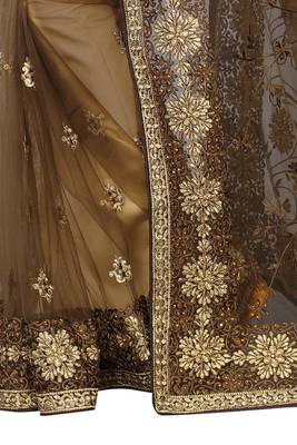 Beige embroidered net saree with blouse 4