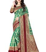 Green woven silk blend saree with blouse