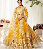 Glamorous Yellow Badla Worked net Party Wear Lehenga Choli