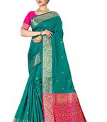 Dark green woven silk blend saree with blouse