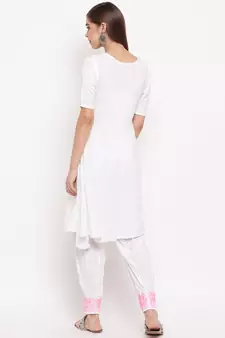 White chikankari a-line  kurti with pink thread work paired with designer salwars