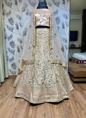 Peach embroidered satin semi stitched lehenga 1