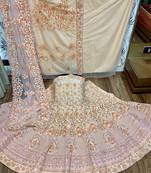 Peach embroidered net semi stitched lehenga