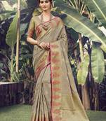 Beige woven banarasi silk saree with blouse