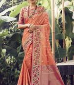 Salmon woven banarasi silk saree with blouse