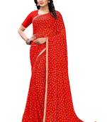 Orange printed chiffon saree with blouse