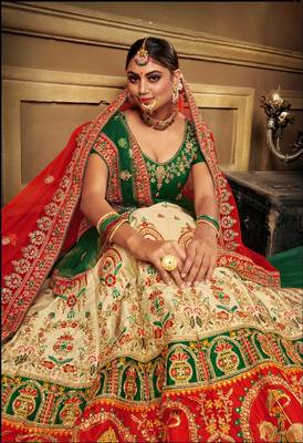 Cream embroidered satin semi stitched lehenga 2