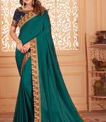 Turquoise embroidered silk blend saree with blouse