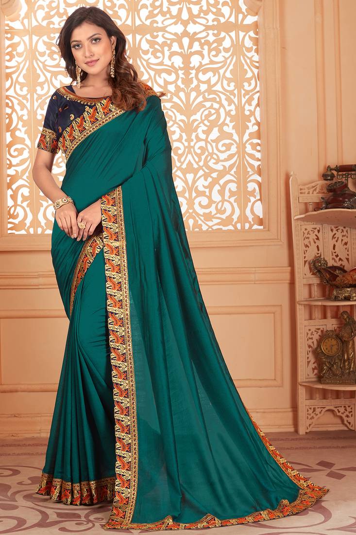 Turquoise embroidered silk blend saree with blouse