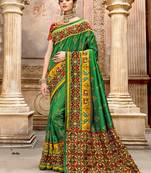   dark green embroidered silk saree with blouse