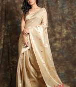 Beige woven silk  saree with zari work and blouse