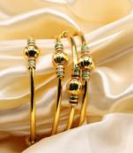 Set Of Four Bangles In Gold Color
