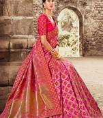 Pink woven Banarasi silk blend saree with blouse