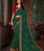 Dark green embroidered silk blend saree with blouse