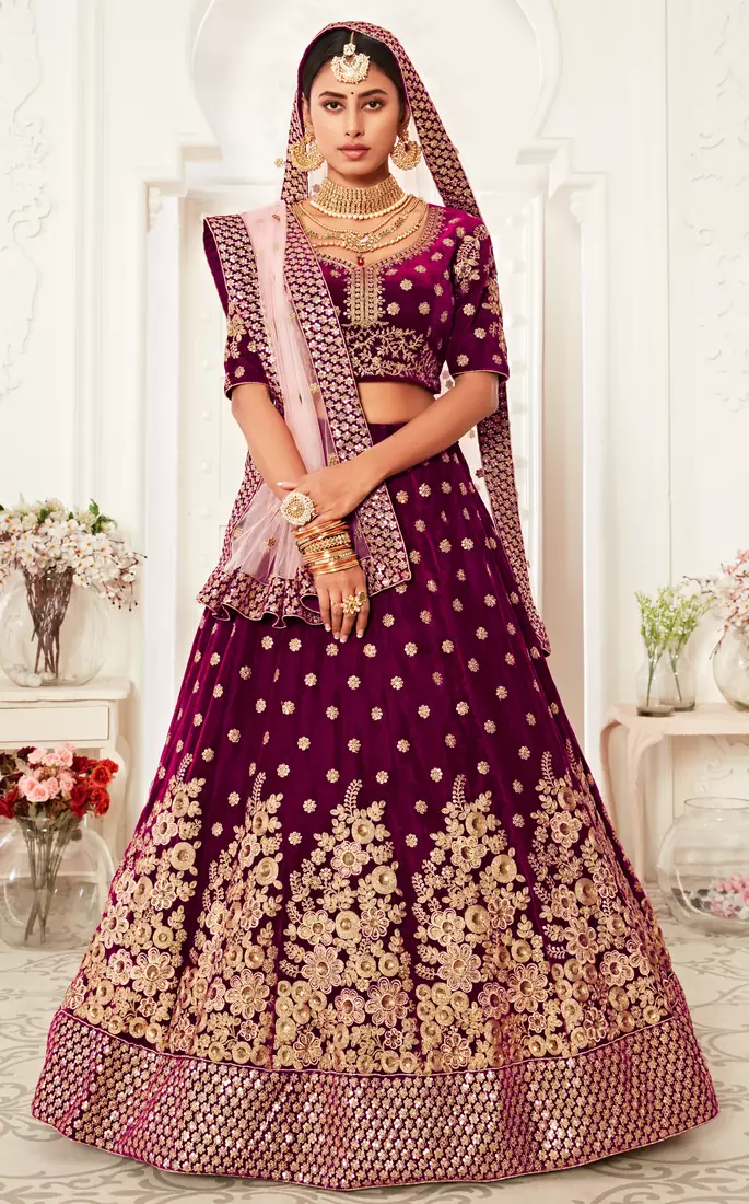 Engaging Purple Zari, Sequins and thread embroidered velvet fabric lehenga choli for dulhan