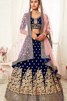 Alluring Navy-blue Zari, Sequins and thread embroidered Velvet Fabric Lehenga choli for bridal