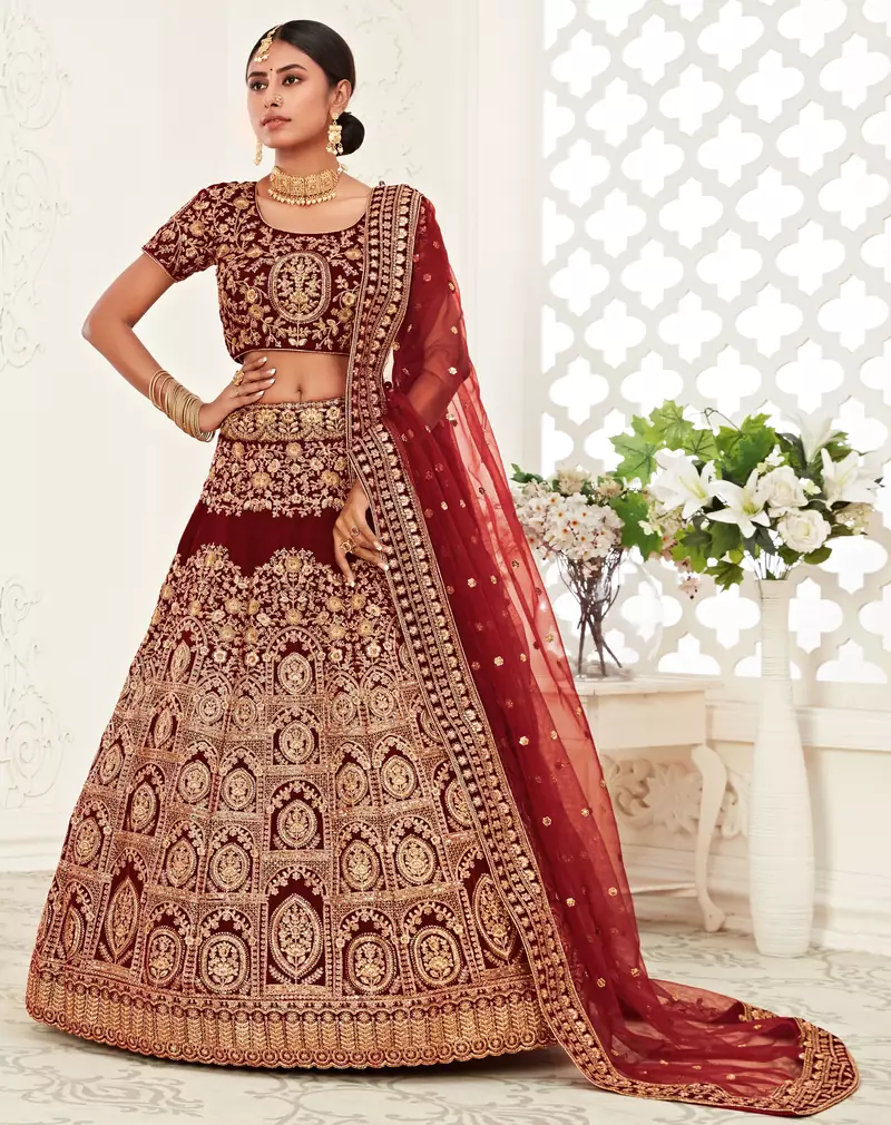 Mesmerizing Dark Red Zari, Sequins and Thread Embroidered Velvet Fabric Lehenga choli for Wedding