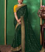 Dark green embroidered satin saree with blouse