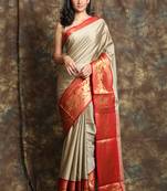 Dark beige woven silk blend saree with blouse