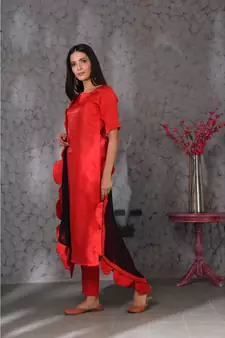 Red art silk kurta set paired with scalloup duppatta
