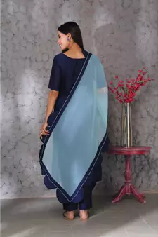 Blue art silk kurta set paired with scalloup duppatta