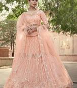 Peach sequins net semi stitched lehenga