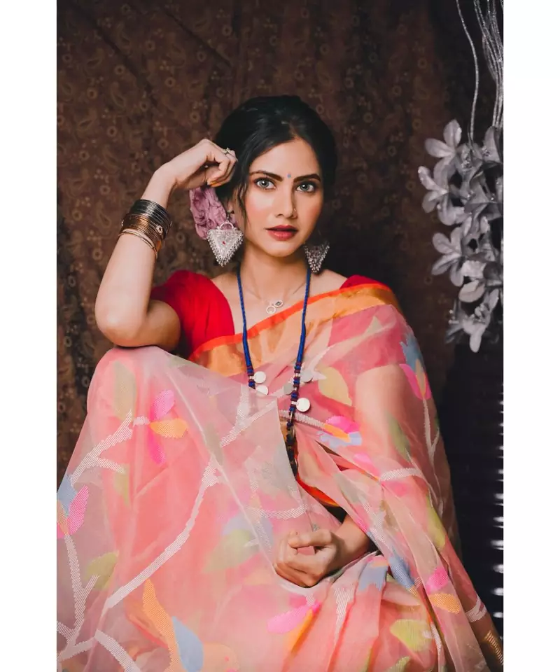 Stunning resham silk jamdani saree in peach with all over multi colour floral work