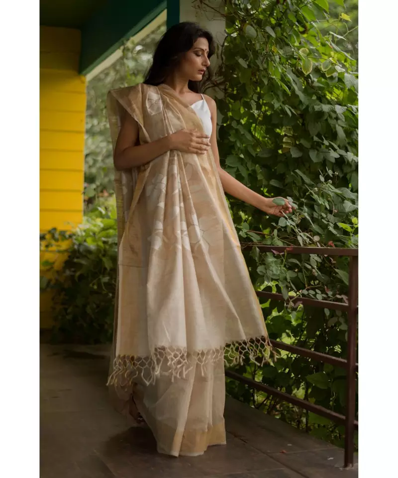 Stunning matka silk jamdani saree in beige with all over floral motifs