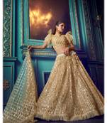 Beige embroidered net semi stitched lehenga