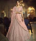 Peach embroidered net semi stitched lehenga