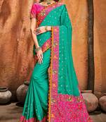 Turquoise embroidered satin saree with blouse