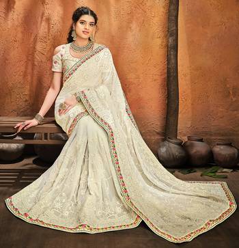 Cream embroidered georgette saree with blouse 2