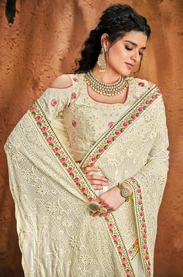 Cream embroidered georgette saree with blouse 3
