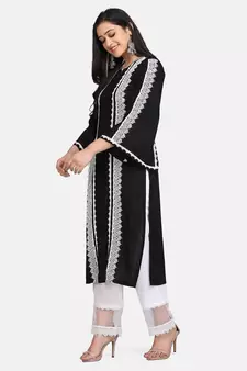 Black kurti all over laces with white pant with net border
