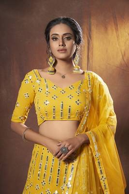 Yellow embroidered net semi stitched lehenga 3