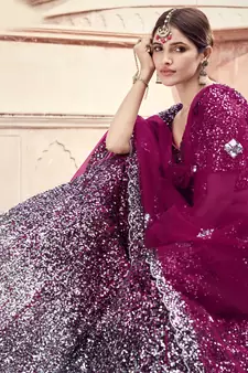 Glamorous Wine Colored Sequins embroidered Net Fabric Lehenga choli for wedding
