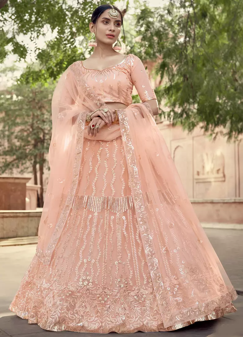 Peach embroidered net semi stitched Bridal lehenga