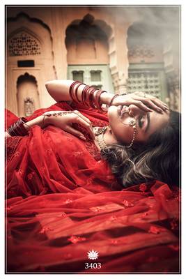Red embroidered net Semi Stitched Bridal lehenga 3