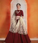 Maroon embroidered velvet semi stitched lehenga