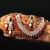 White Kundan & Red Moti Necklace Sets