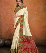 Off white embroidered pure satin saree with blouse