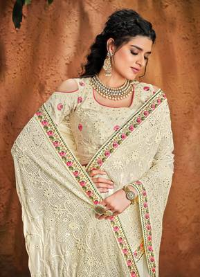 Off white embroidered pure georgette saree with blouse 2