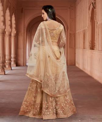 Beige embroidered net semi stitched lehenga 3