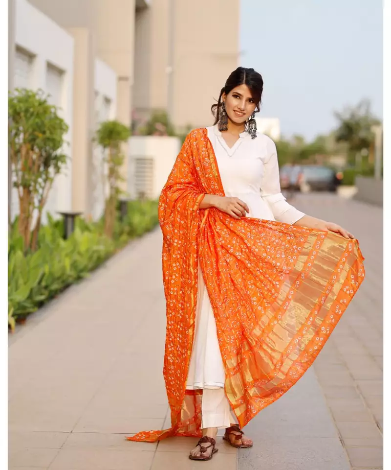 Bright white flared kurta set with bandej dupatta
