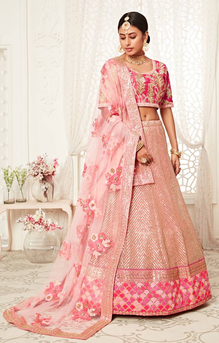Hypnotizing Pink Zari Sequins And Thread Embroidered Designer Net Lehenga Choli