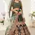 Delightful Dark Green Zari, Sequins and Thread Embroidered velvet fabric lehenga choli for wedding