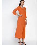 cotton flex rust orange jumpsuit with an overlap panel and tie up
