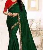 Dark green embroidered raw silk saree with blouse